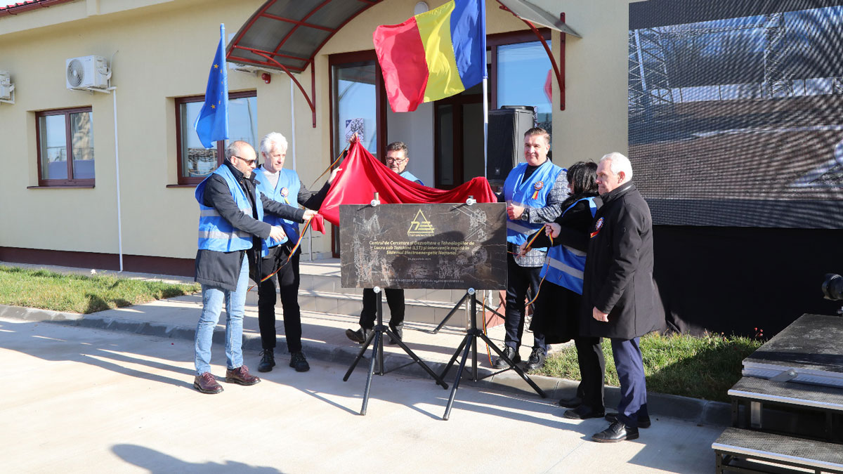 Transelectrica has inaugurated in Sibiu the Research and Development Centre for Live-Line Working and Rapid Intervention Technologies in the National Energy System, the last component of a large investment initiated in 2017 and carried out in two stages. Thus, the second phase completes the development of the ‘Stelian Alexandru Gal’ Centre of Excellence in Sibiu, which includes both the Live-Line Working Polygon, completed in 2021, and the new infrastructure dedicated to research, testing and training. It is the only facility of its kind in Romania and is becoming a training space for specialists from the entire National Energy System. Work on this stage began in 2020, cost RON 6.3 million, and was carried out by the Total NSA AG Construct and Pro Hart Group consortium. The investment aims to become in a short time a reference in the field to increase the professional performance and skills of energy specialists. Thus, the new facility provides the necessary conditions for practical training in a controlled, voltage-free environment, where real operating situations can be simulated. The infrastructure has been designed for the regular training of Transelectrica’s technical staff and for the training of other specialists from the country or from abroad. The design and use of these facilities aim to improve operational safety, extend the life of equipment, and reduce downtime, which are essential objectives for the national power transmission grid and are integrated into the Company’s asset modernization and development strategy. At the same time, one of the main objectives of the Centre is, besides professional training, also specialized consultancy in the field of Live-Line Working (LLW). The centre supports Transelectrica’s current activities in professional training, promotion and implementation of new technologies in the network, development of technical standards, reports, and working methodologies. As part of this professional development facility, operators from the Power Transmission Grid and their trainers receive regular training to keep them up to date with the new technologies introduced in National Energy System facilities. The material base of the ‘Stelian Alexandru Gal’ Centre of Excellence in Sibiu brings together training grounds for overhead power lines of different voltage levels, station and transformer grounds, as well as a training building equipped with workshops and laboratories for multispectral inspections and pilot project testing. This infrastructure allows the replication of real operating situations and the development of the necessary skills for safe and efficient interventions. Ensuring the maintenance of the Power Transmission Grid and adopting the most efficient techniques for achieving it represent a strategic concern of Transelectrica. The current requirements on the quality and continuity of electricity supply, the economic implications and the European obligations impose the use of new technologies with increased efficiency for the transmission and distribution activities in the energy field. Thus, the Company is focusing on strengthening its Live-Line Working (LLW) capabilities, utilizing the facilities of the LLW Centre of Excellence and lines at Sibiu, and the National Energy System rapid intervention teams. The first phase of the project, finalized in 2021, concerned the LLW Polygon, a RON 5.7 million investment of own funds, which provides facilities for practicing work in substations and on overhead lines. By pursuing and completing this approach, the Sibiu centre consolidates its role as a centre of competence in the field of LLW. The vision of the centre is to strengthen its role as a reference point in the field of LLW, able to provide training tailored to the needs of operators, at high quality standards. Under the coordination of Transelectrica’s Department of Excellence in Energy, the Centre’s team of specialists has carried out training and improvement programs, demonstrated new technologies, provided consultancy, participated in maintenance projects, coordinated the introduction of LLW technologies in the Power Transmission Grid, updated internal regulations and contributed to technical solutions for repairing faults, applying LLW methods. By completing the Research and Development Centre for Live-Line Working and Rapid Intervention Technologies in the National Energy System, Transelectrica strengthens the professional training structure in the National Energy System and supports the development of essential skills for the safe operation of the national energy infrastructure.
